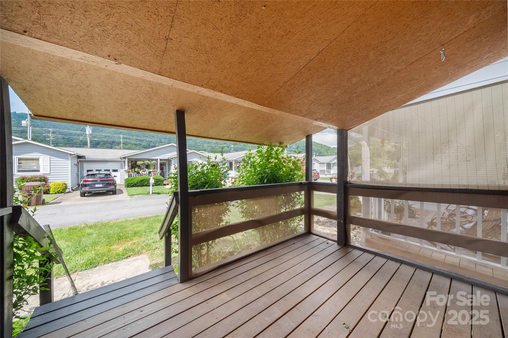 94 Market Street Maggie Valley, NC 28751 - Photo 34 of 40 a view of two chairs in a balcony