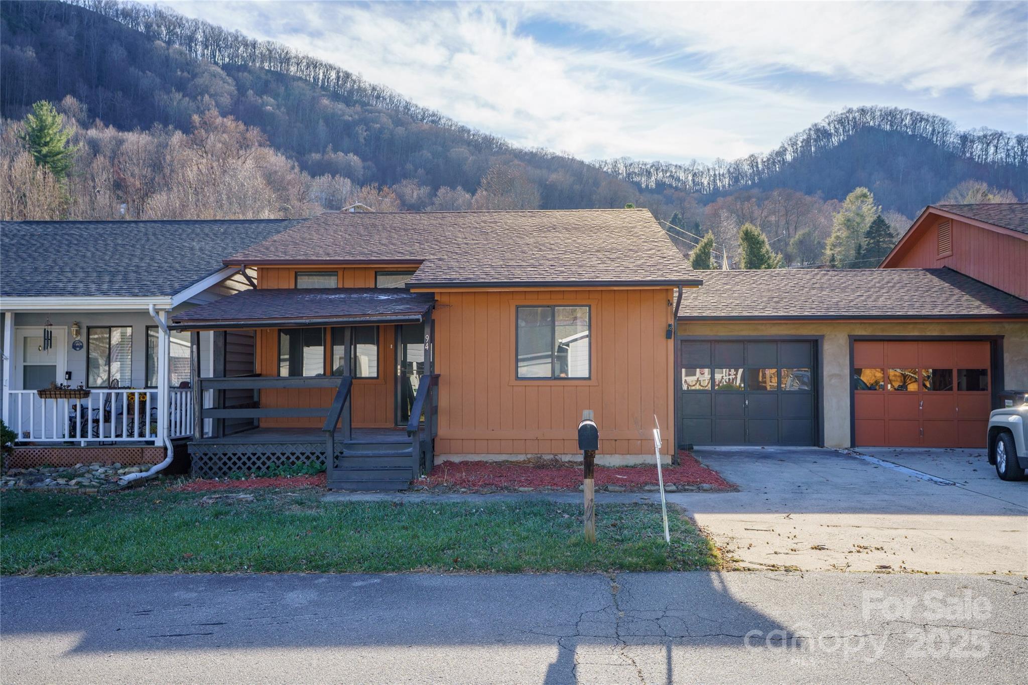 94 Market Street Maggie Valley, NC 28751 - Photo 5 of 40 a front view of a house with a yard