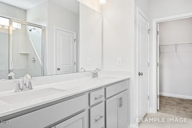 a bathroom with a sink and mirror