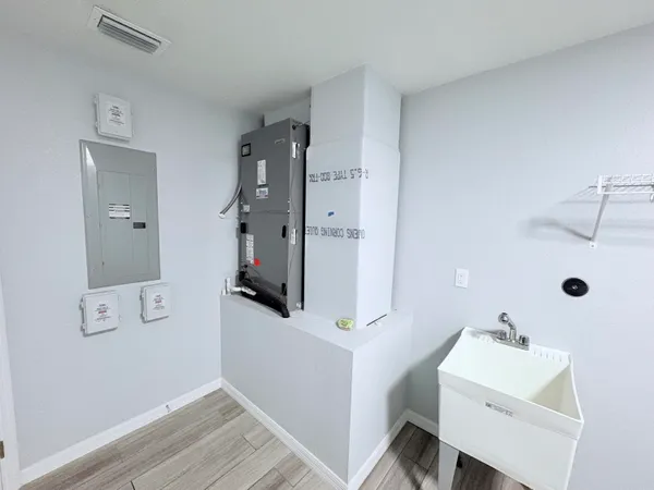 a bathroom with a sink and mirror
