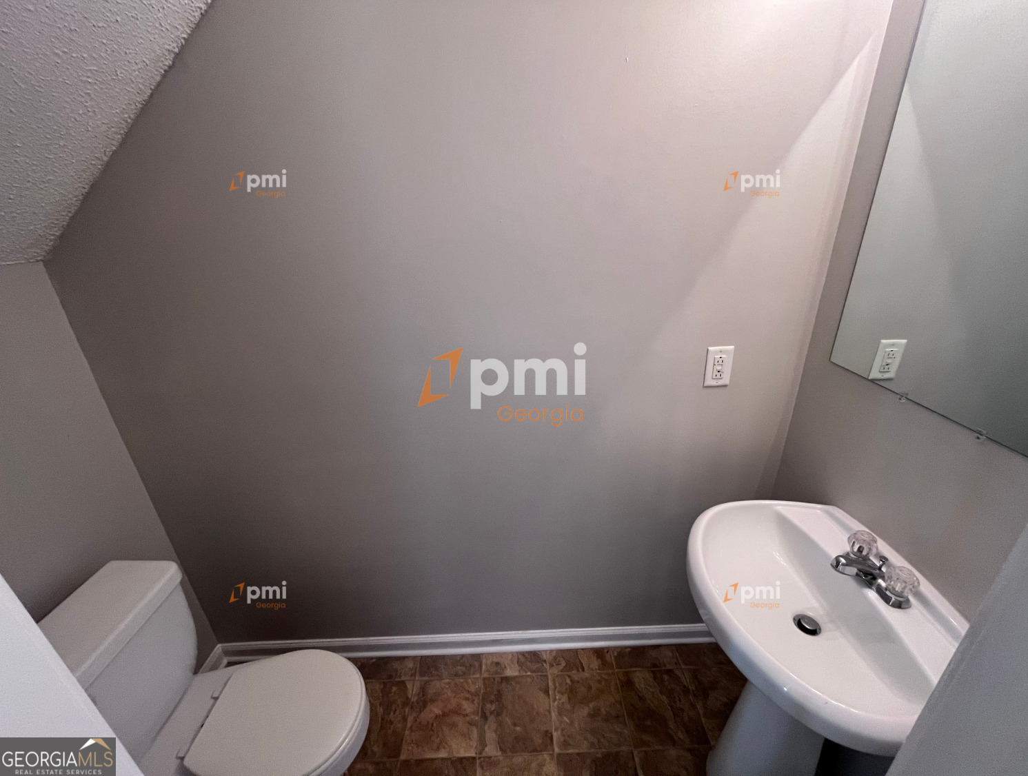 2015 Ivy Lane Union City, GA 30291 - Photo 16 of 18 a bathroom with a toilet sink and mirror
