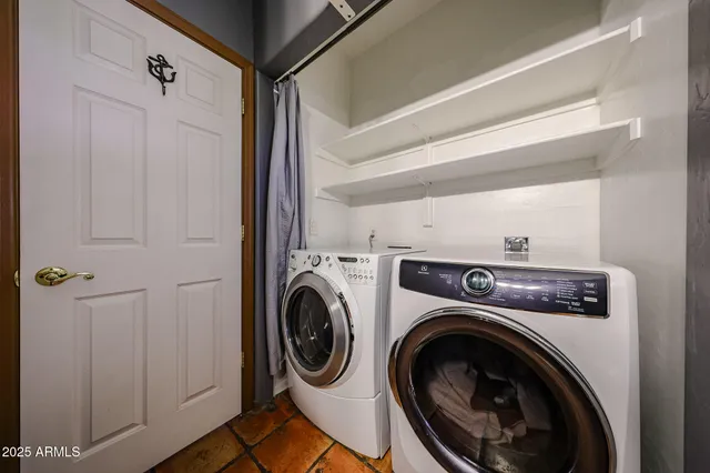 a view of a porch with furniture and a yard