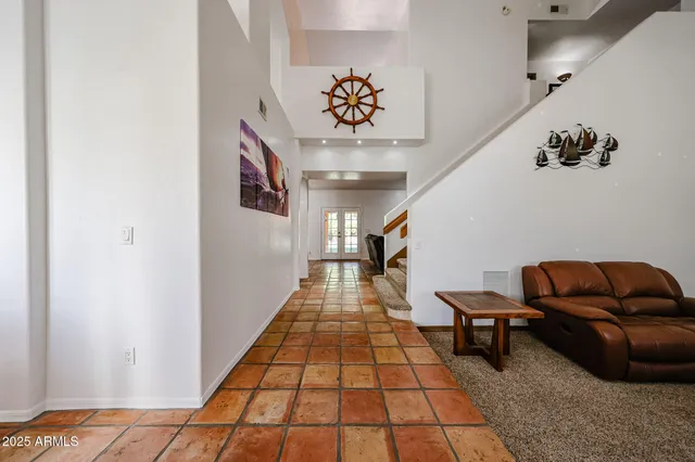 a view of a dining room with furniture and window