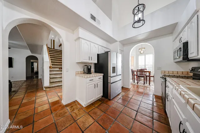 a bathroom with a double vanity sink a mirror and a bathtub