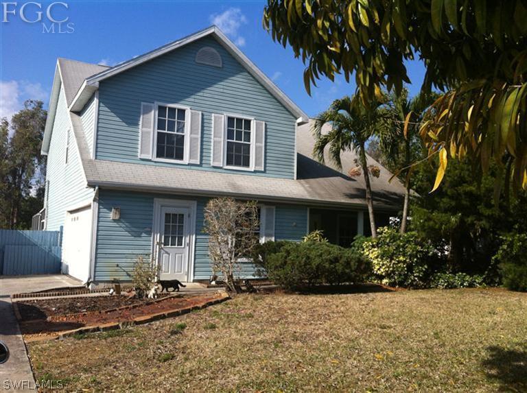 9151 Caloosa Road Fort Myers, FL 33967 - Photo 1 of 2 a front view of a house with garden