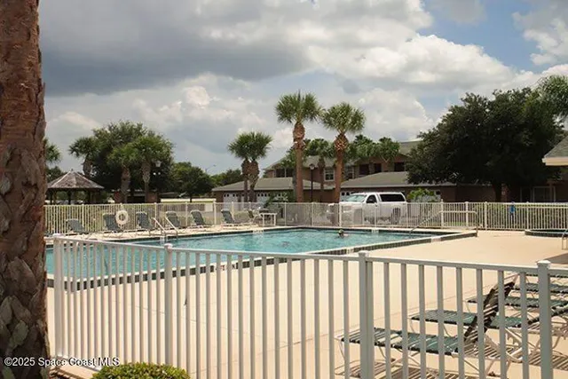 a view of swimming pool from a balcony