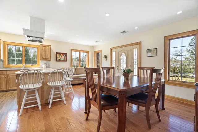 a view of a dining room with furniture window and wooden floor