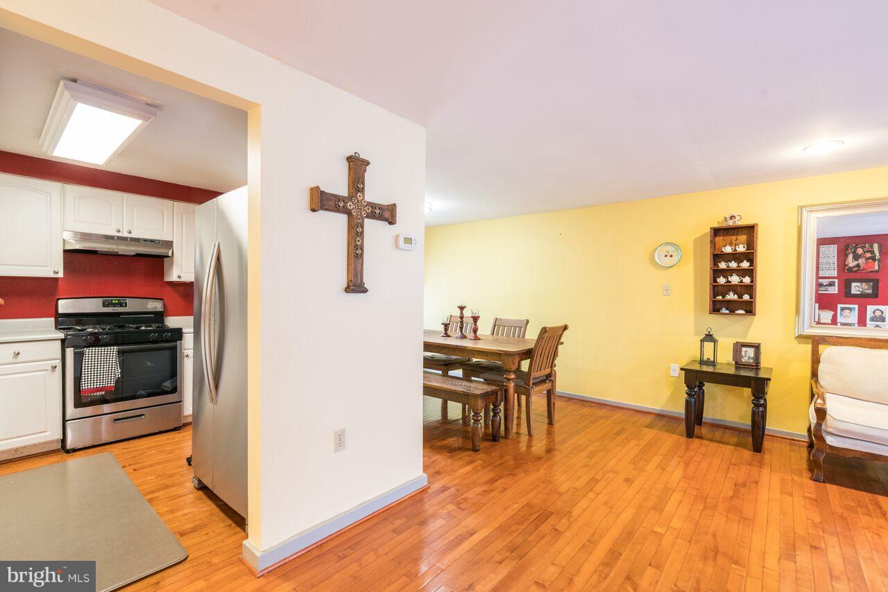 2330 Old Trail Drive Reston, VA 20191 - Photo 11 of 28 a living room with furniture and a flat screen tv