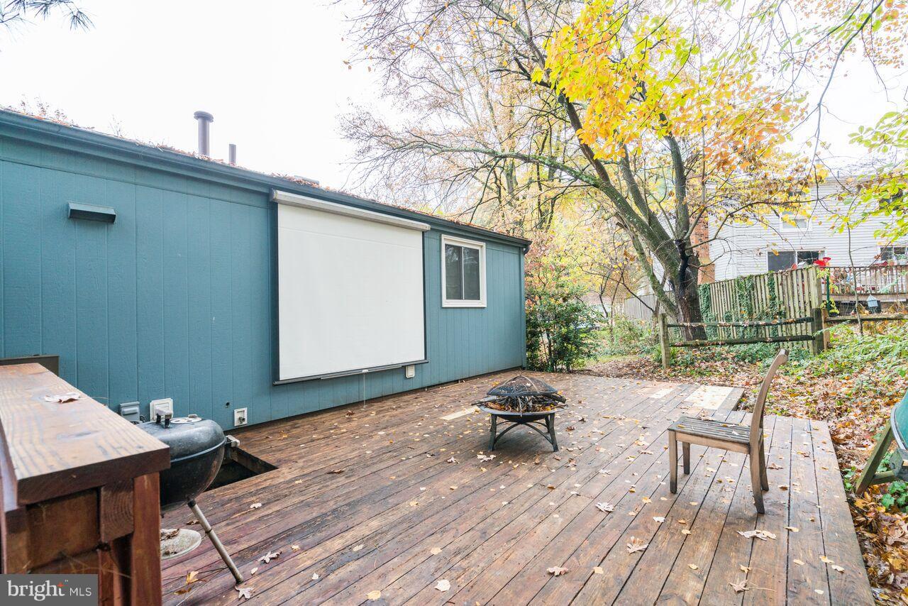 2330 Old Trail Drive Reston, VA 20191 - Photo 28 of 28 a backyard of a house with barbeque oven table and chairs
