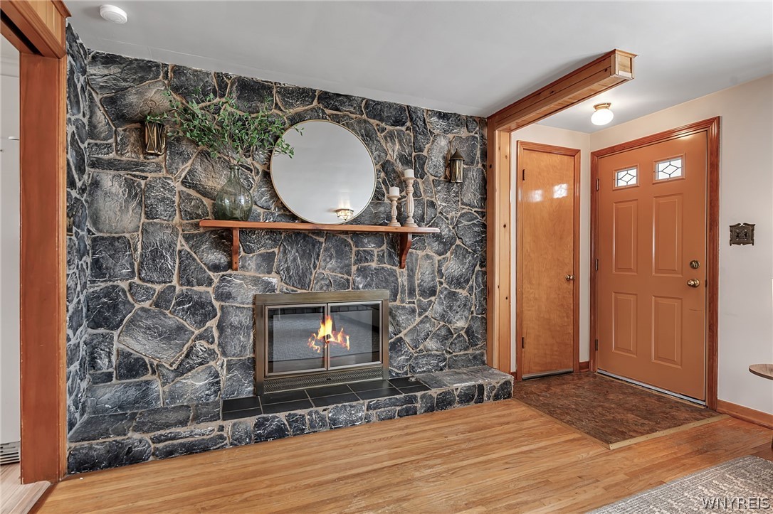 21 Addison Avenue Amherst, NY 14226 - Photo 3 of 43 FRONT DOOR ENTRY- note:flame in fireplace is stage