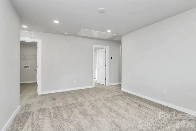 a bathroom with a double vanity sink toilet and shower