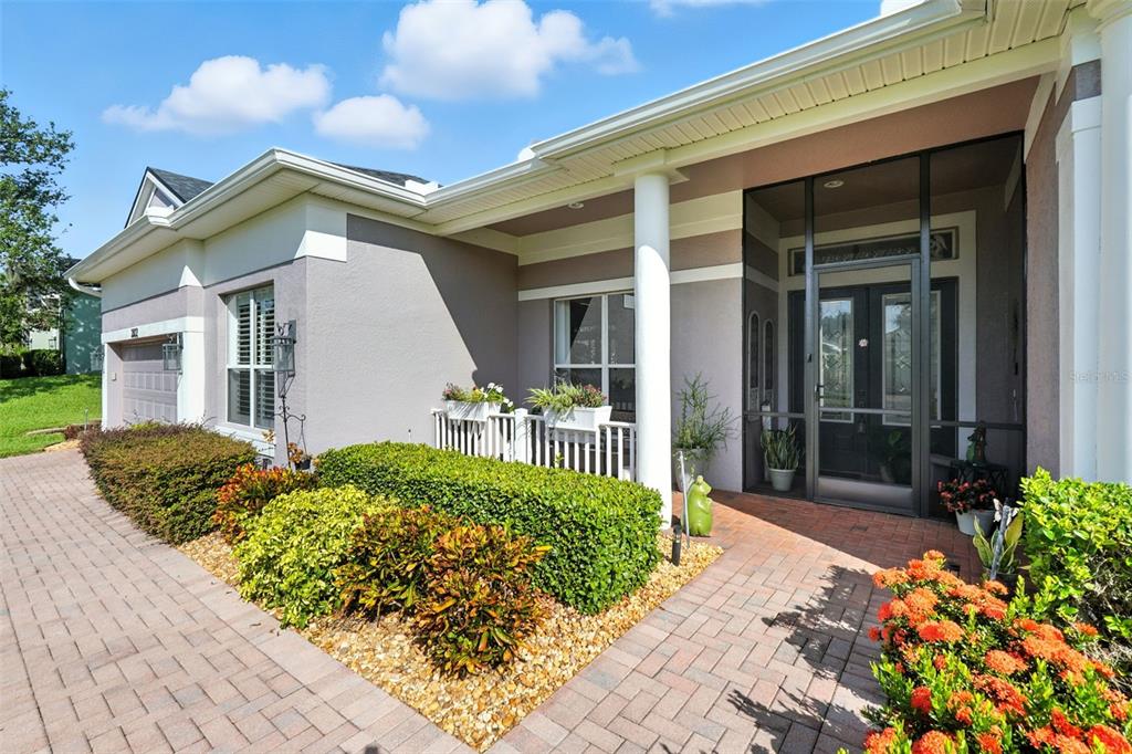 2822 Falcon Ridge Clermont, FL 34711 - Photo 2 of 59 a view of a house with a small yard and plants