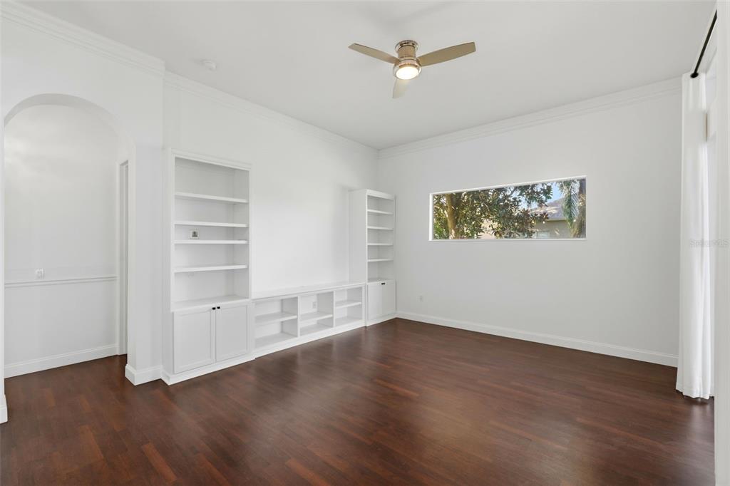 2822 Falcon Ridge Clermont, FL 34711 - Photo 22 of 59 a view of empty room with wooden floor and window