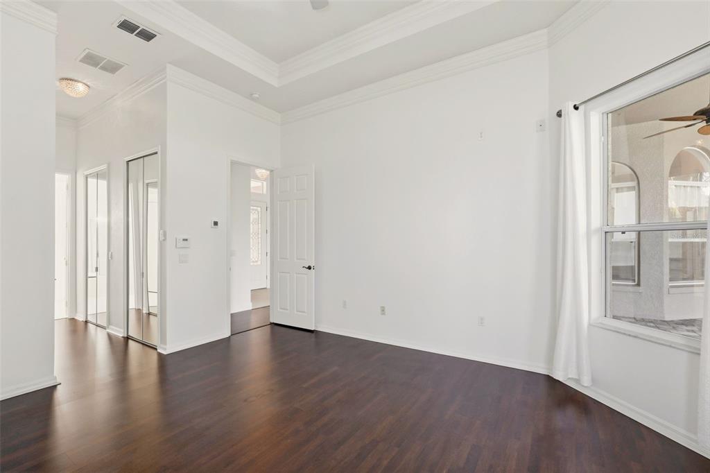 2822 Falcon Ridge Clermont, FL 34711 - Photo 26 of 59 wooden floor in an empty room with a window