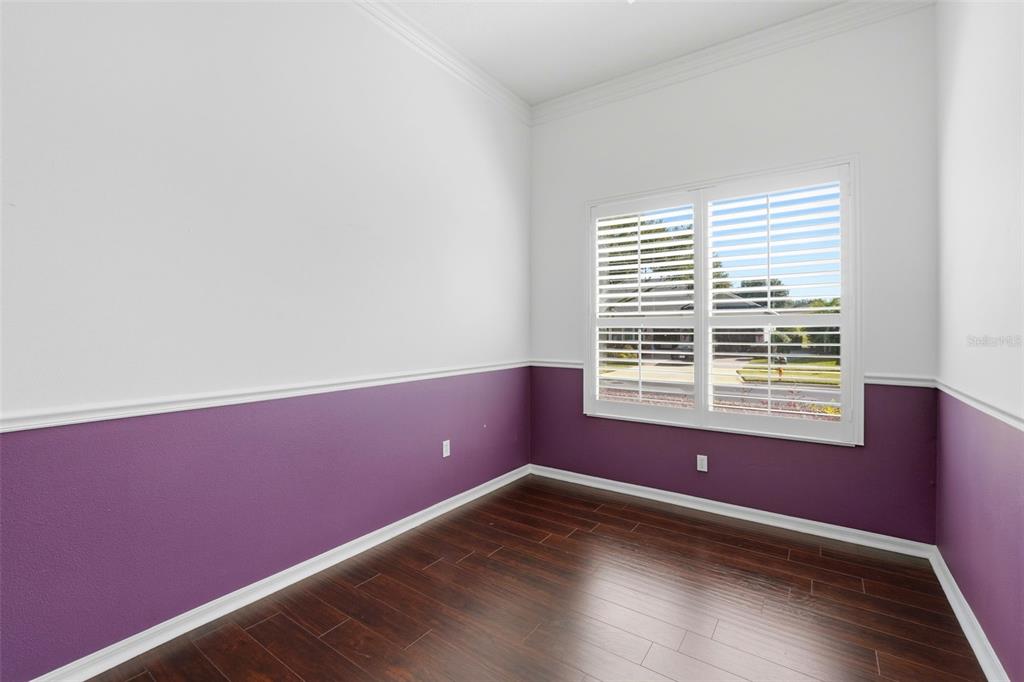2822 Falcon Ridge Clermont, FL 34711 - Photo 31 of 59 a view of an empty room with wooden floor and a window