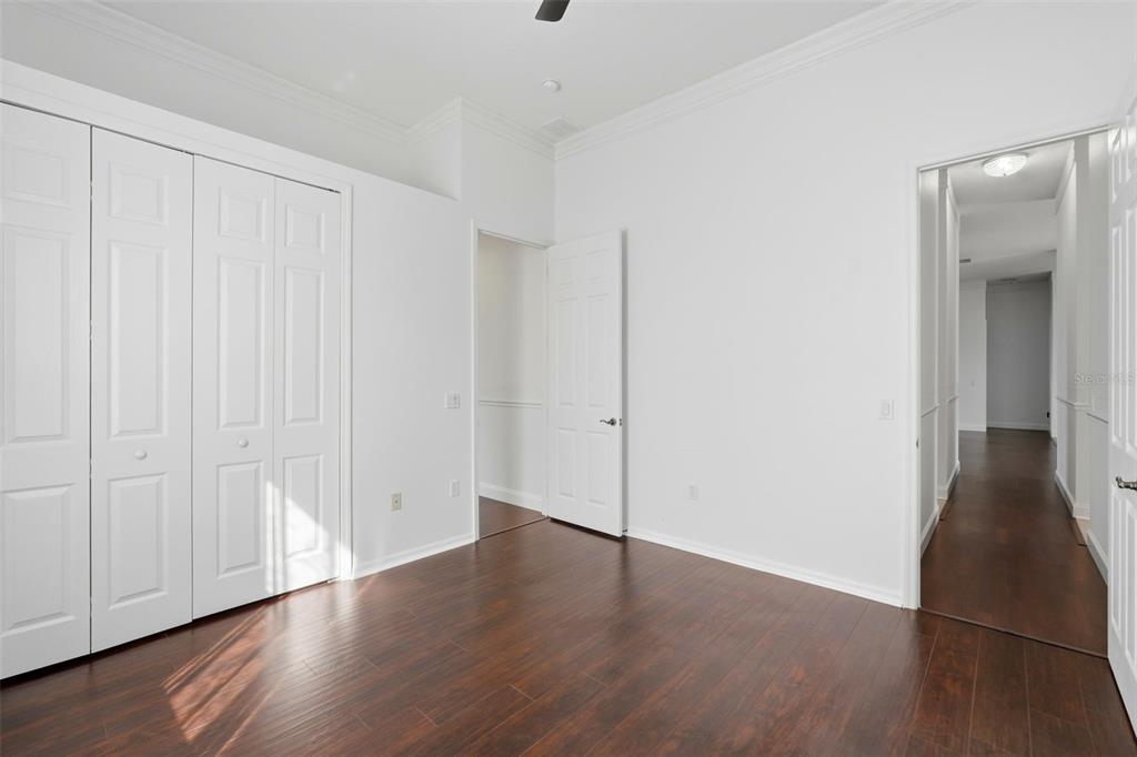 2822 Falcon Ridge Clermont, FL 34711 - Photo 33 of 59 a view of an empty room with wooden floor