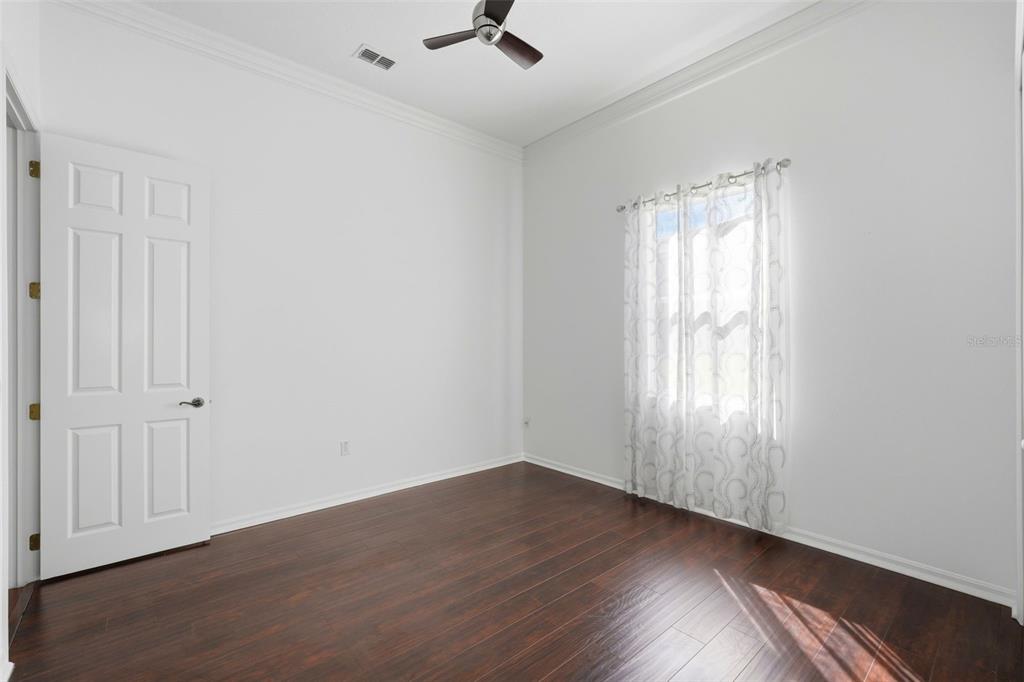 2822 Falcon Ridge Clermont, FL 34711 - Photo 34 of 59 wooden floor in an empty room with a window