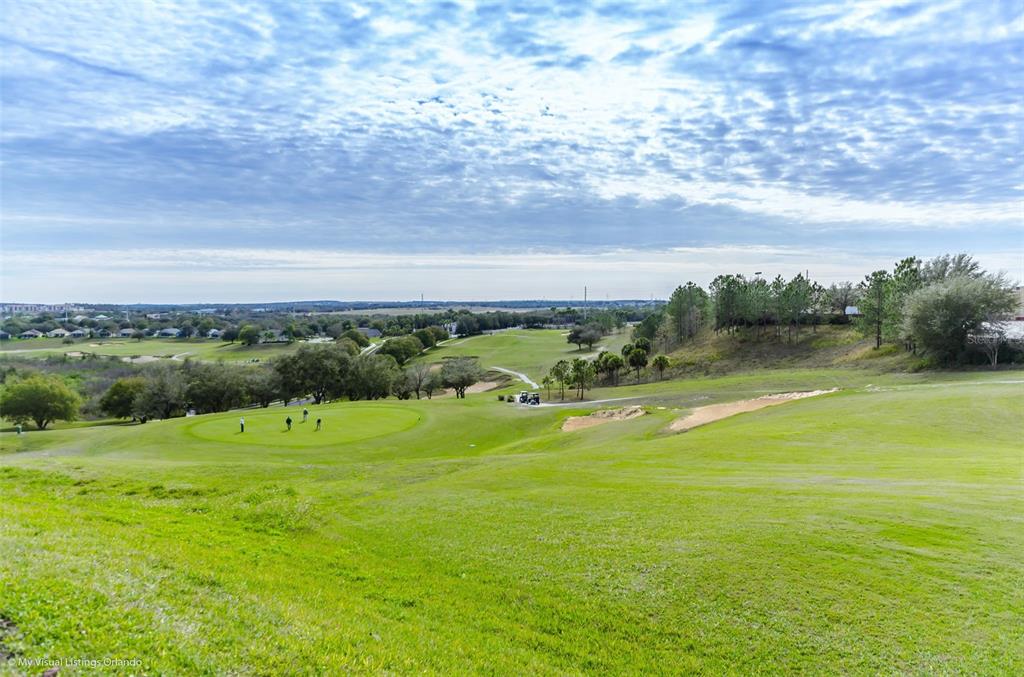 2822 Falcon Ridge Clermont, FL 34711 - Photo 44 of 59 a view of a golf course with an outdoor space