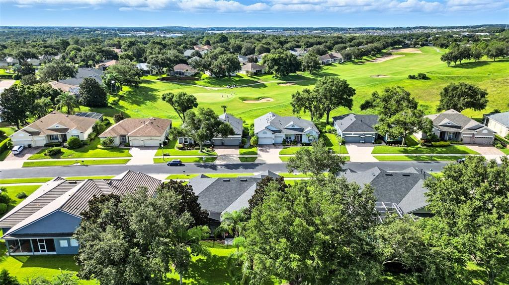 2822 Falcon Ridge Clermont, FL 34711 - Photo 58 of 59 an aerial view of residential houses with outdoor space and swimming pool