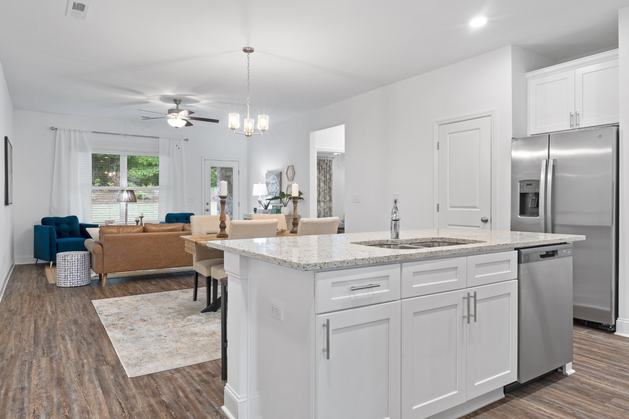 12076 Mdw Pl Lane, Unit 12076 Madison, AL 35757 - Photo 2 of 11 a kitchen with kitchen island granite countertop a sink cabinets and stainless steel appliances