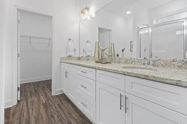 a bathroom with a granite countertop sink mirror and