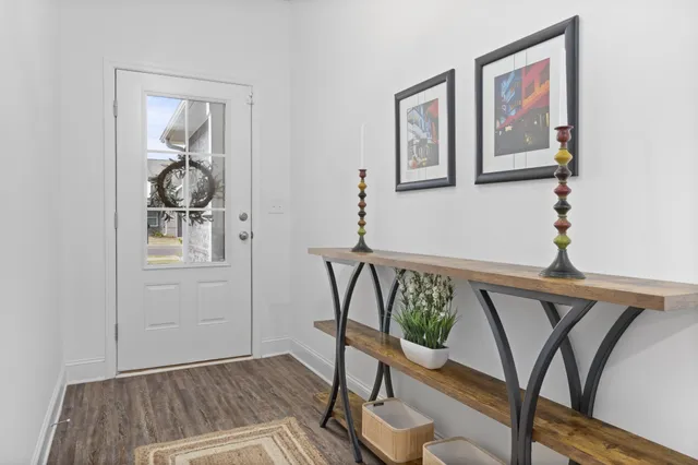 a view of a livingroom with furniture and wooden floor