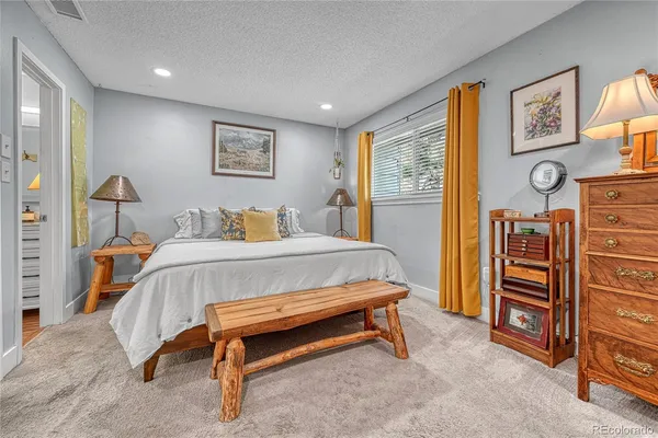 a bedroom with a bed and furniture