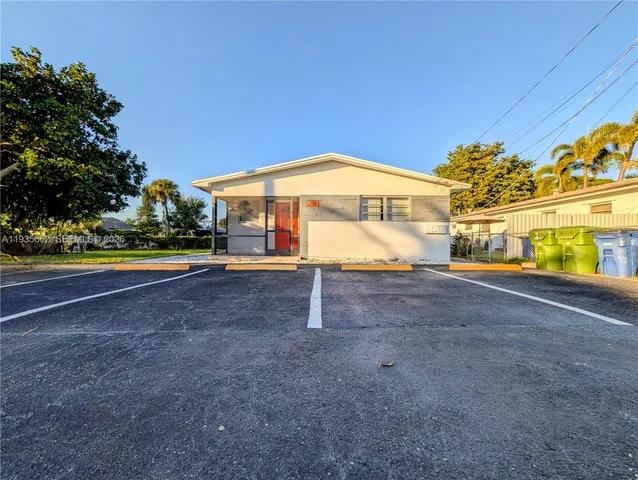 a house with swimming pool in front of it