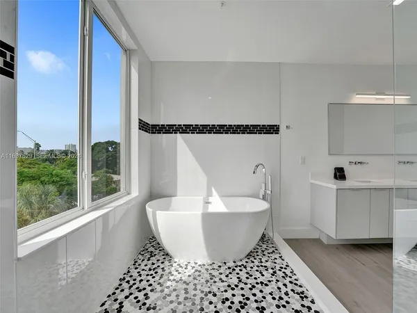 a living room with a couch and a dresser