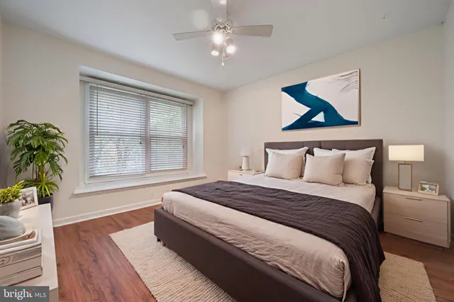 a bedroom with bed and a window