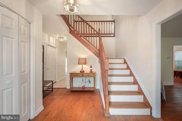 a view of entryway and hall with wooden floor
