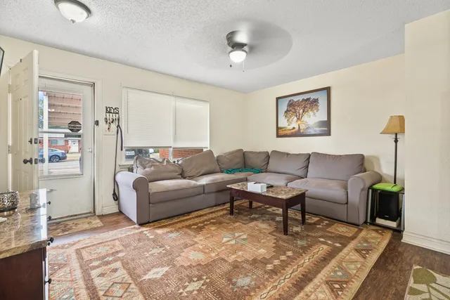a living room with furniture and a rug