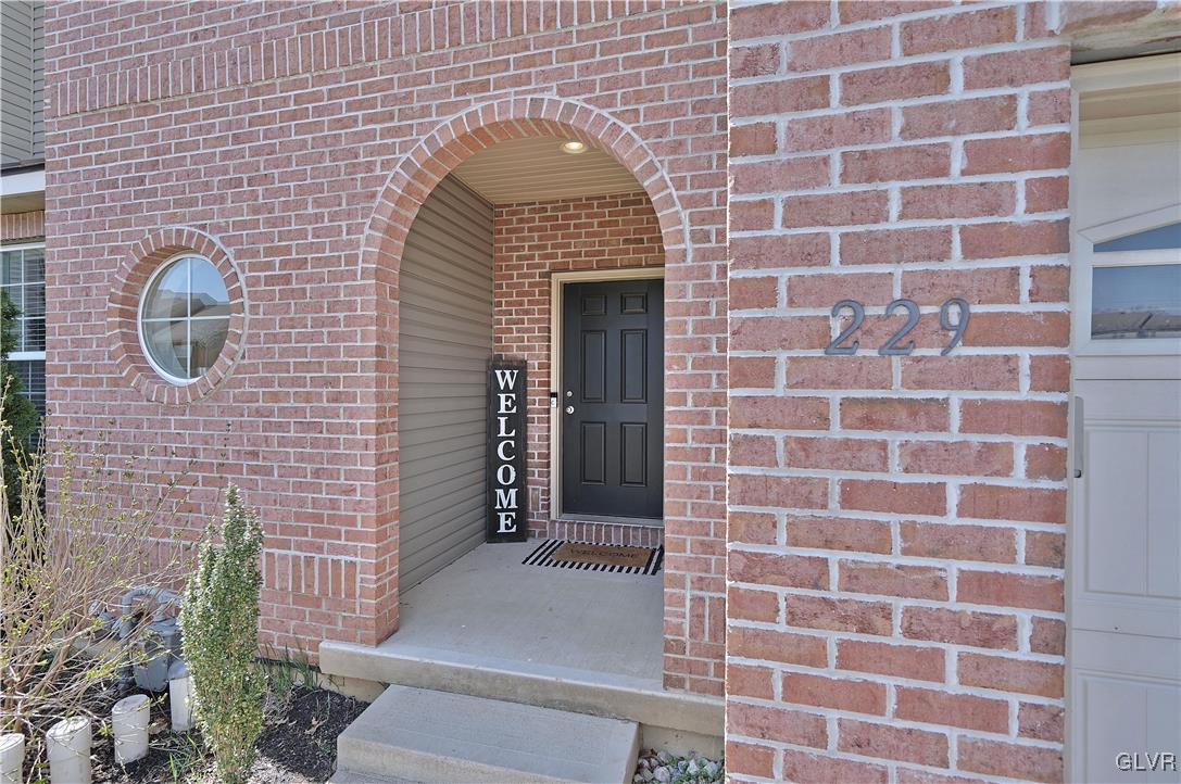 229 Snapdragon Way Allentown, PA 18104 - Photo 1 of 27 a front view of a house with a garden