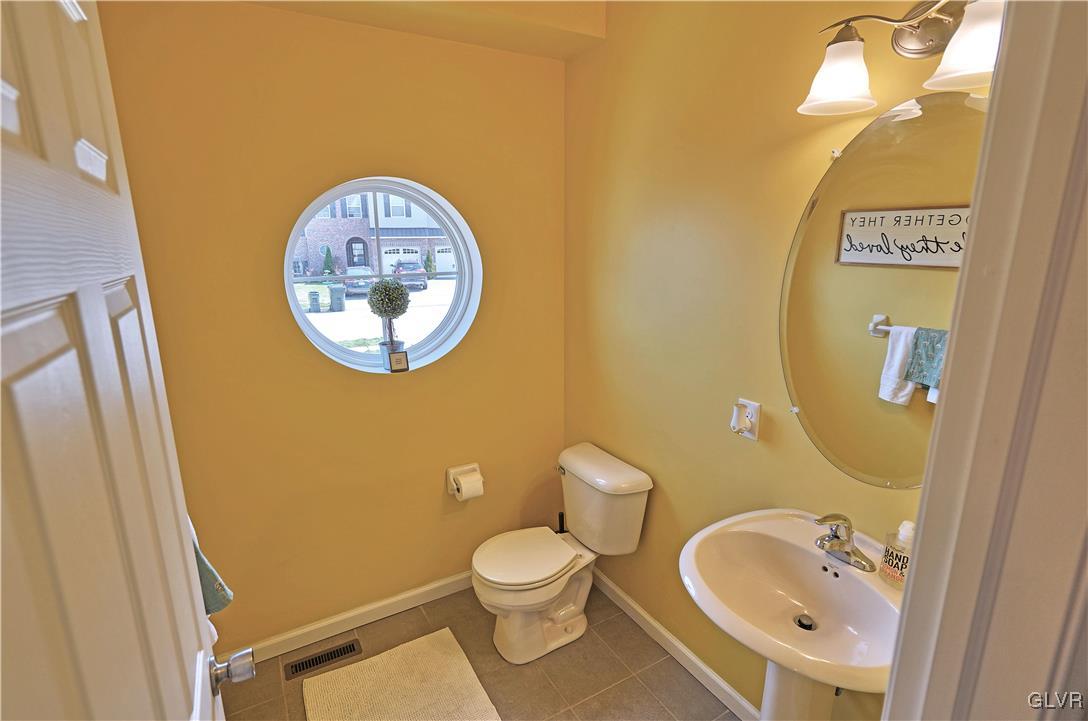 229 Snapdragon Way Allentown, PA 18104 - Photo 12 of 27 a bathroom with a toilet sink and mirror
