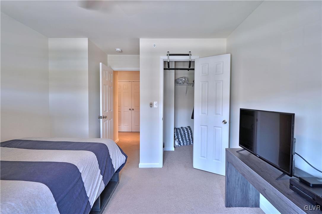 229 Snapdragon Way Allentown, PA 18104 - Photo 24 of 27 a bedroom with a bed and a flat screen tv