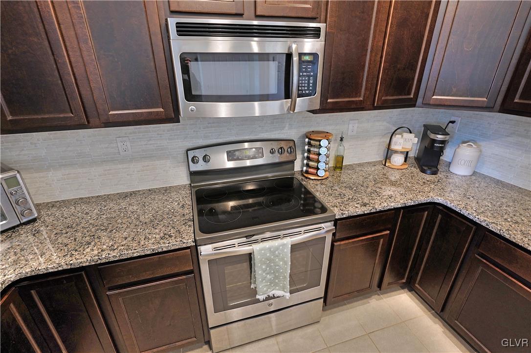 229 Snapdragon Way Allentown, PA 18104 - Photo 6 of 27 a kitchen with granite countertop cabinets stainless steel appliances and sink