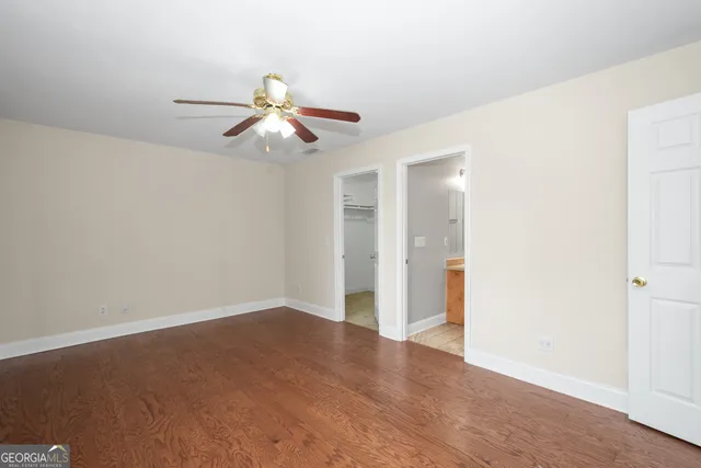 a bathroom with a toilet and shower