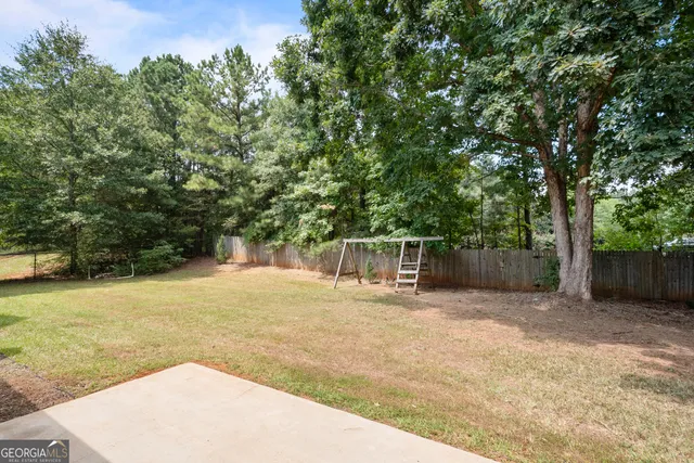 a backyard of a house with lots of green space