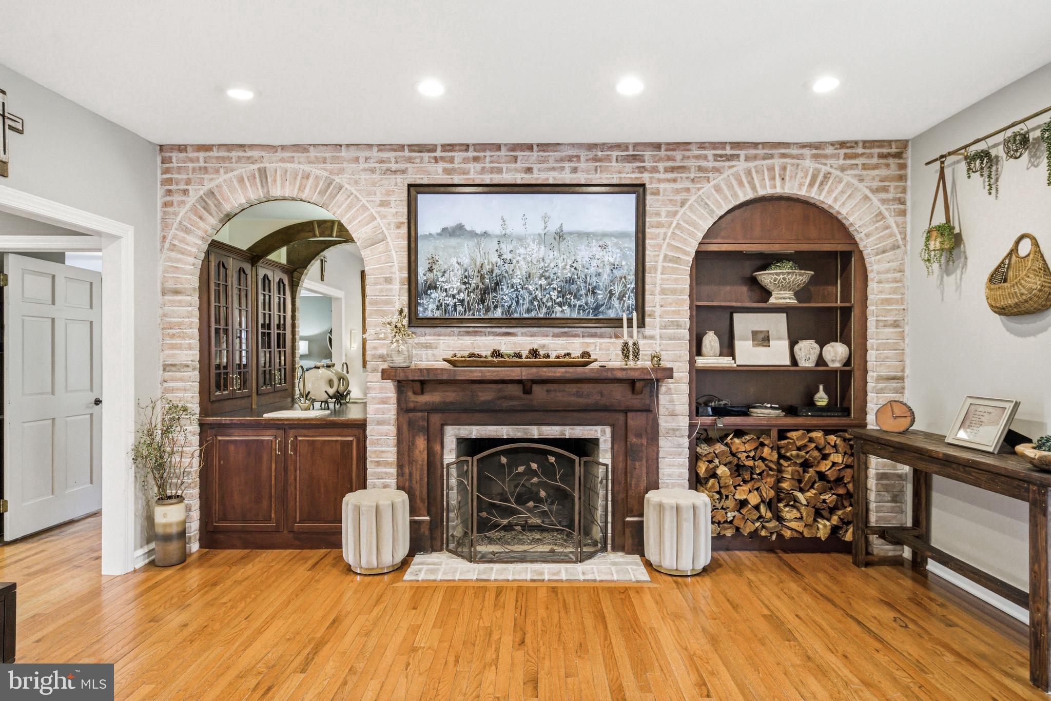 2 Teaberry Drive Medford, NJ 08055 - Photo 17 of 72 a living room with furniture a fireplace and kitchen view