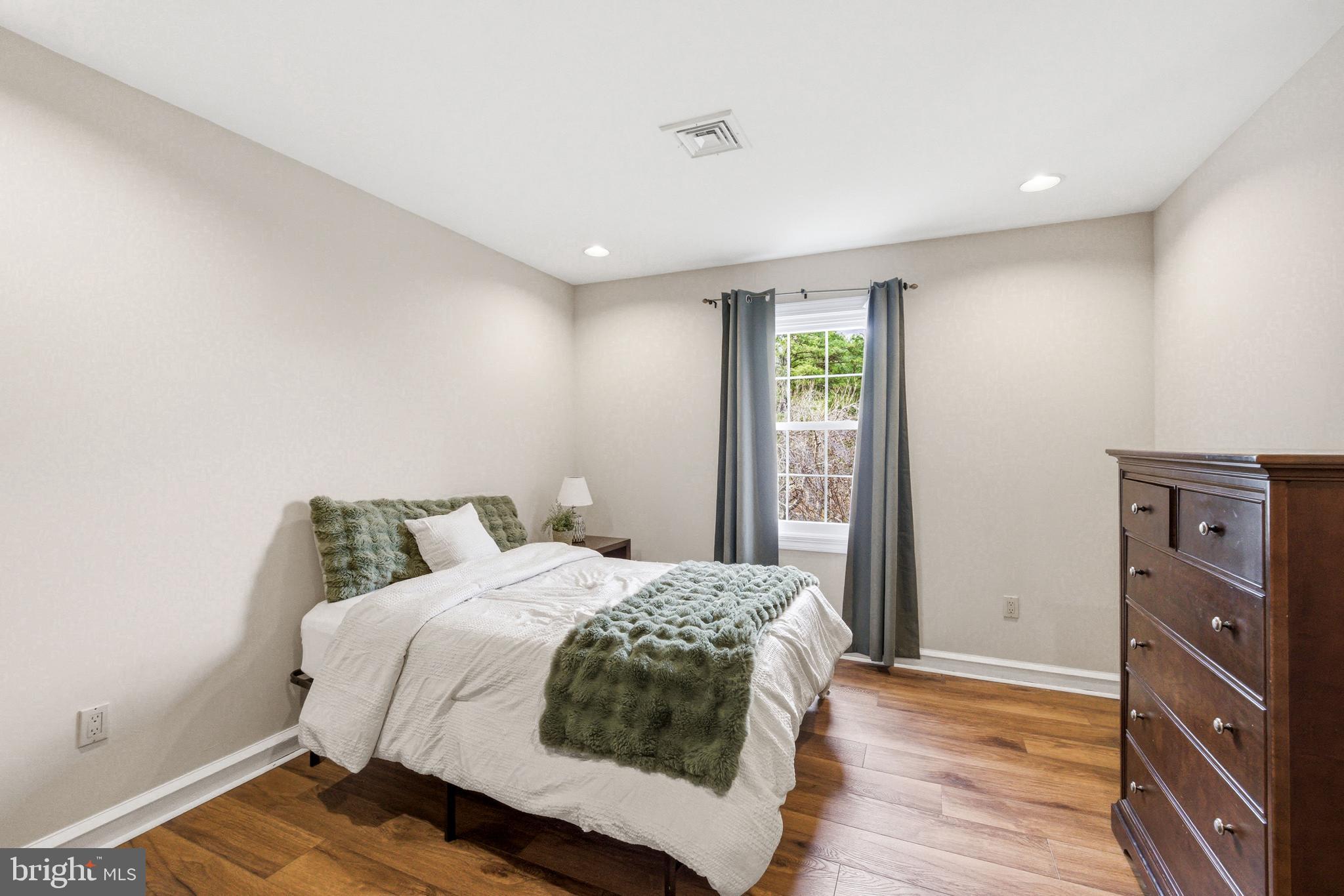 2 Teaberry Drive Medford, NJ 08055 - Photo 40 of 72 a bedroom with a bed and wooden floor