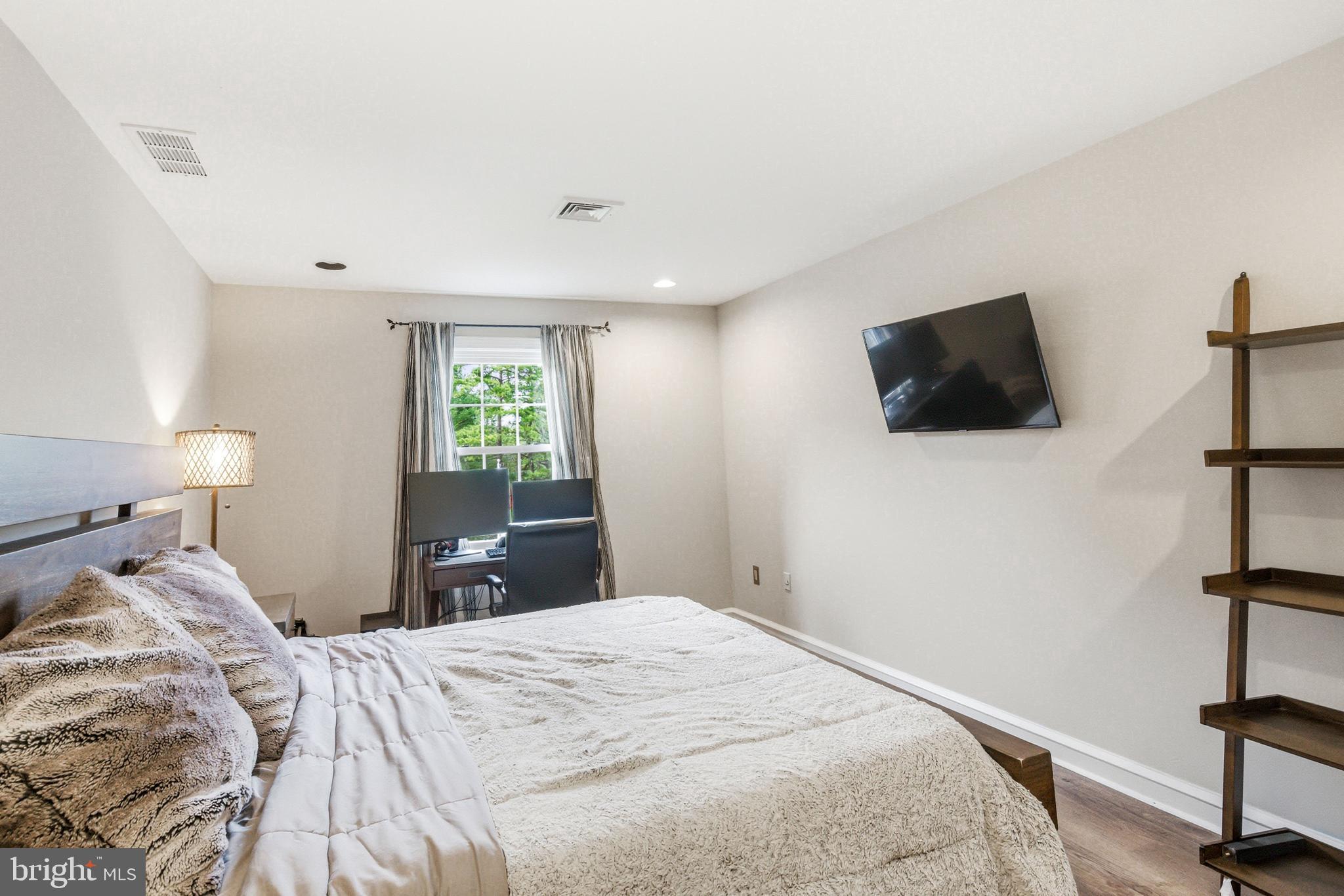 2 Teaberry Drive Medford, NJ 08055 - Photo 41 of 72 a bedroom with a bed and a flat screen tv