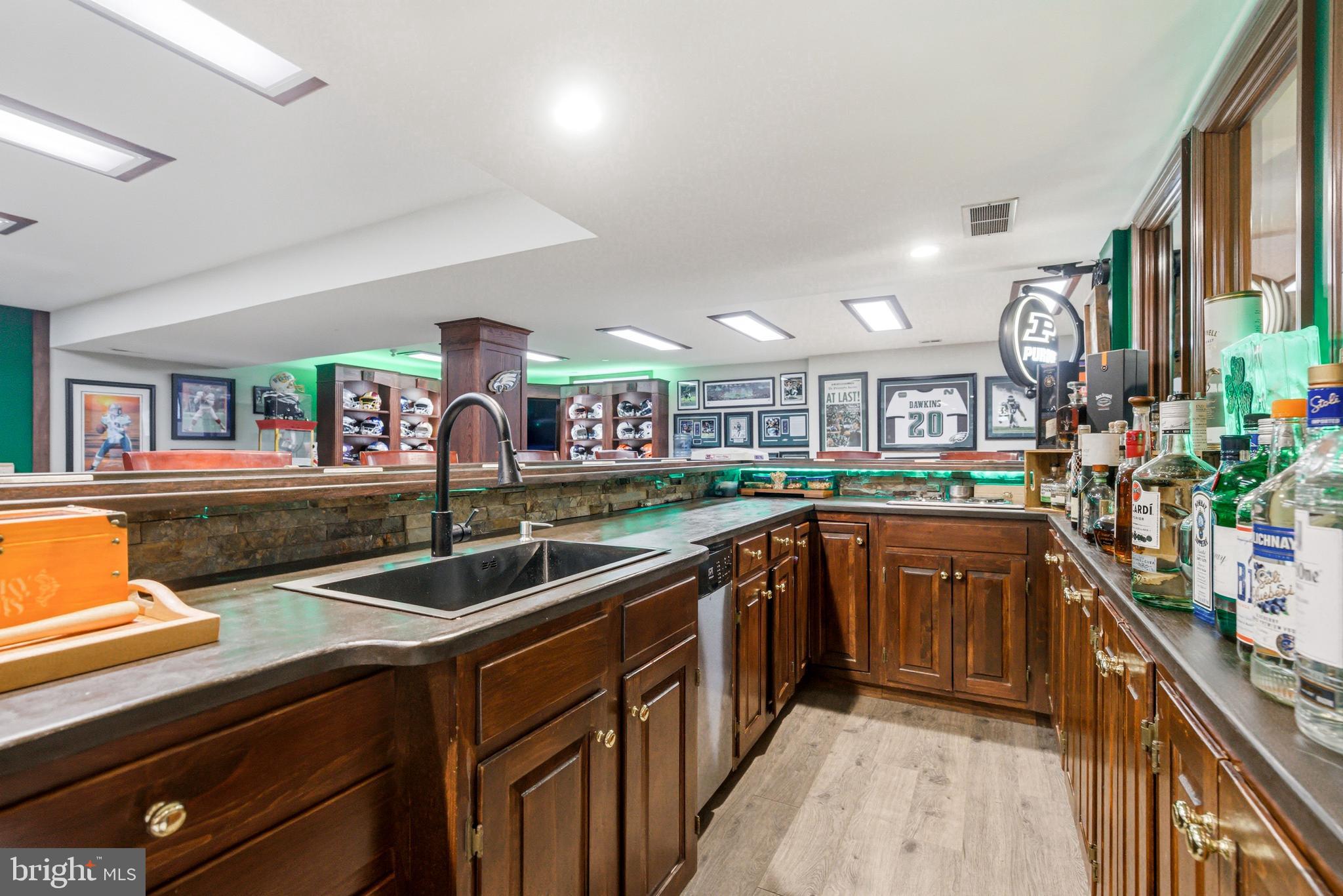 2 Teaberry Drive Medford, NJ 08055 - Photo 45 of 72 a kitchen with stainless steel appliances granite countertop a sink and wooden cabinets