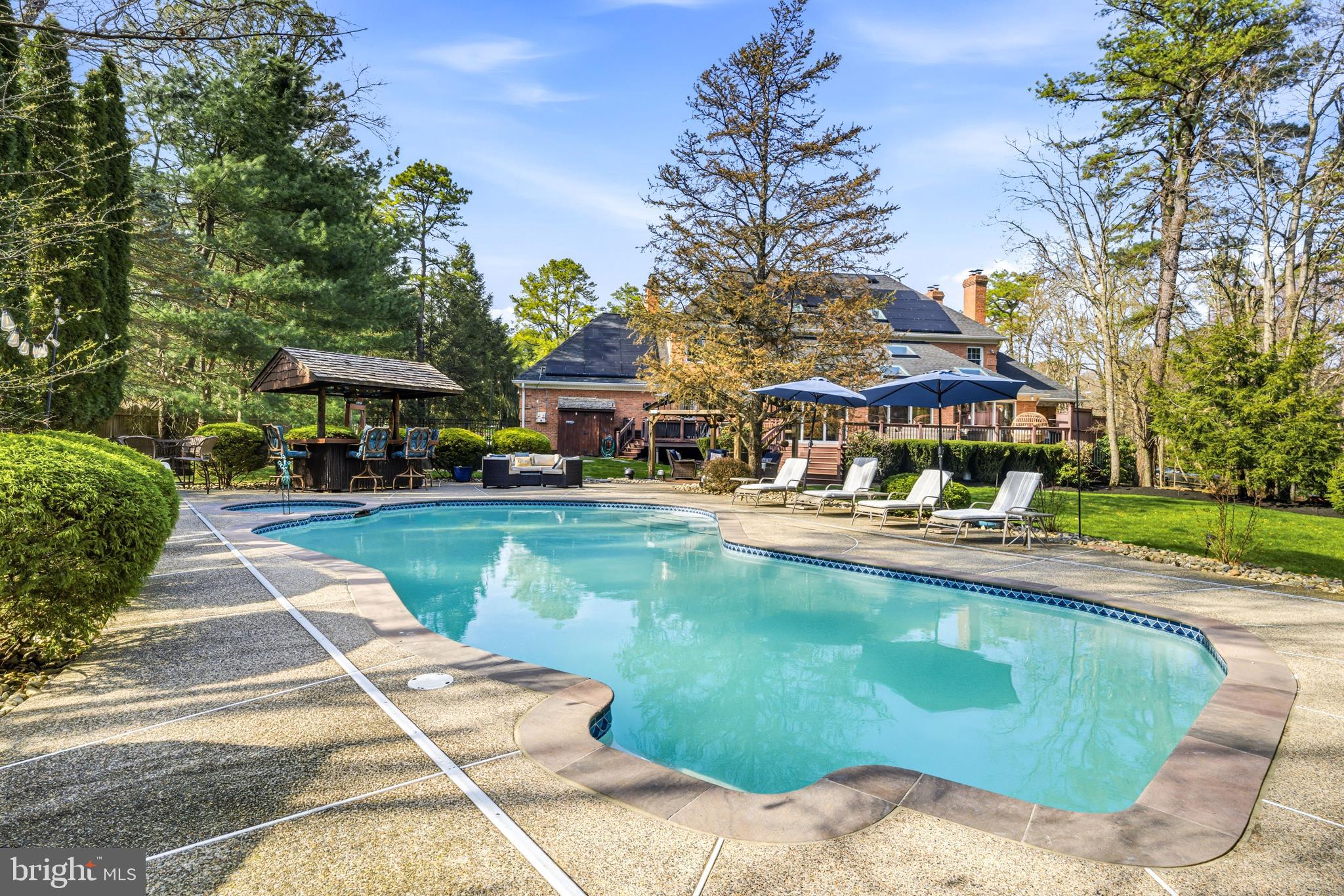 2 Teaberry Drive Medford, NJ 08055 - Photo 55 of 72 a swimming pool with outdoor seating and yard