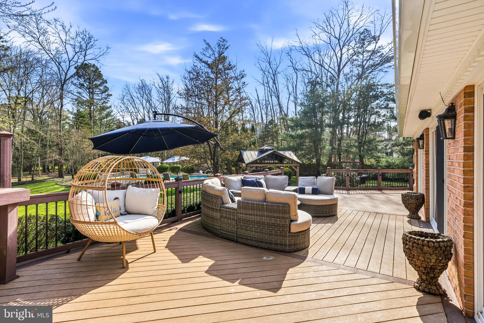 2 Teaberry Drive Medford, NJ 08055 - Photo 59 of 72 a view of a patio with couches and table and chairs with wooden floor and fence