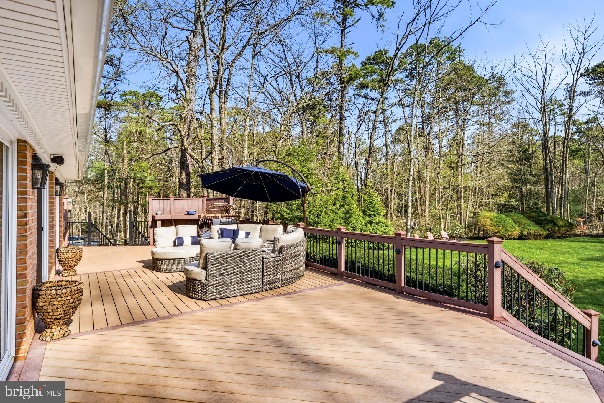 2 Teaberry Drive Medford, NJ 08055 - Photo 60 of 72 a view of a patio with couches and table and chairs next to yard with wooden floor