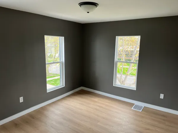 a view of an empty room with a window