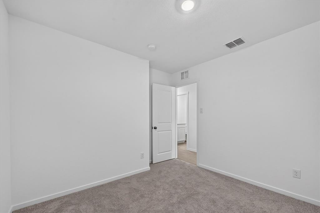 1260 Balsam Road Wilmer, TX 75172 - Photo 10 of 20 Recessed ceiling light, carpet flooring, and a white interior door