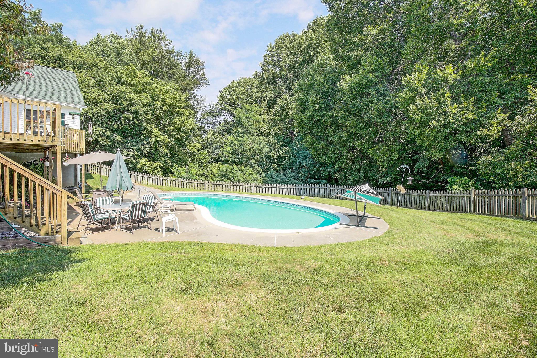4650 Paul Hance Road Huntingtown, MD 20639 - Photo 48 of 57 a view of a house with swimming pool and sitting area