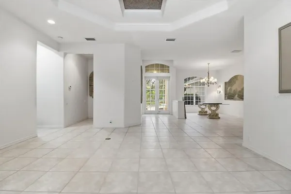 a view of kitchen with furniture and a living room