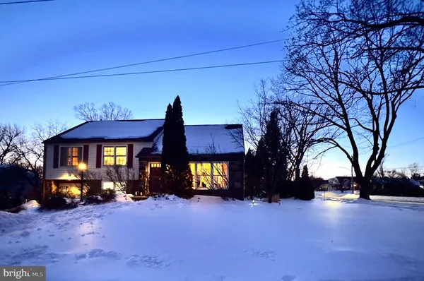 a view of a house with a snow in a yard